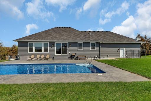 Beautiful Stamped Concrete Patio Surrounds The Swimming Pool