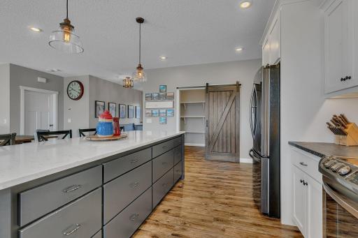 Kitchen With Sliding Barn Door To The Pantry