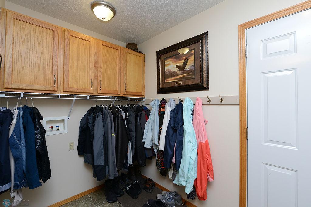 Garage entrance w/hookups for washer/dryer