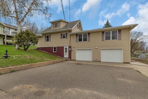 Welcome to a thoughtfully updated home where comfort, convenience, and character come together in perfect harmony. A new concrete parking pad (2021) provides extra space alongside the insulated tuck-under garage.