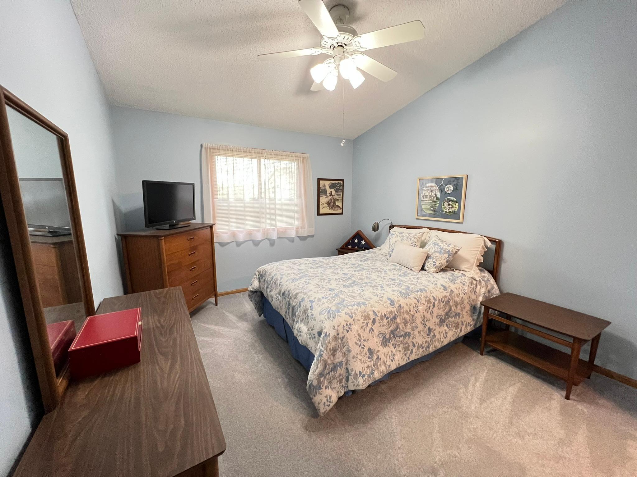 Vaulted main floor primary bedroom