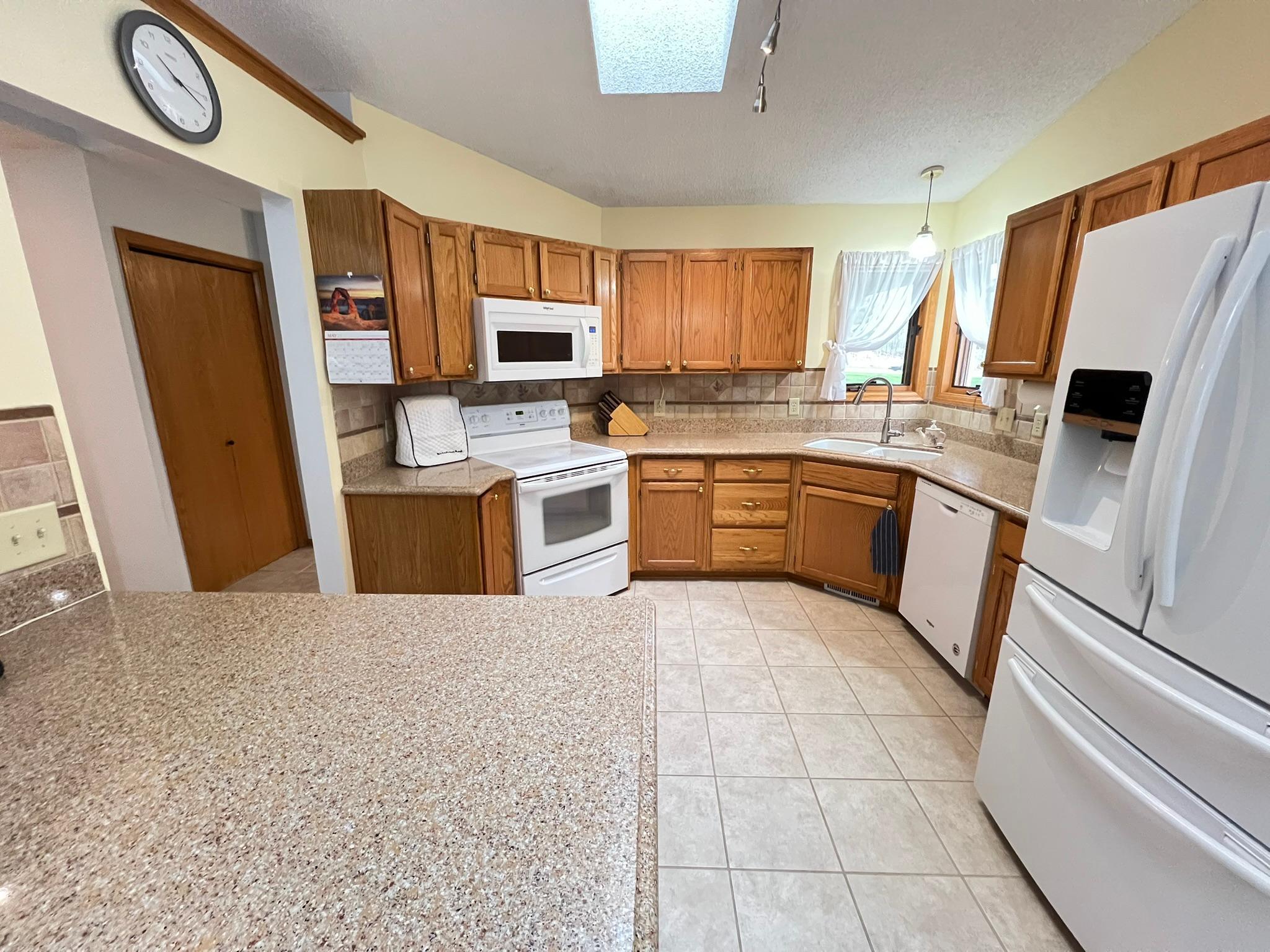 Kitchen also has ceramic tile back splash.