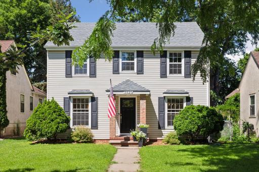 Classic 2-Story Colonial in demand Windom Neighborhood. The exterior boasts classic brick porch pillars and low maintenance siding.