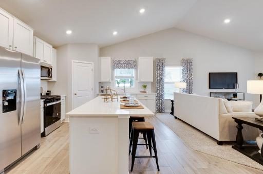 Stunning in every direction, the kitchen is also remarkably functional - leaving plenty of space for the family chef to maneuver and prepare that next meal. Photo of model, colors and options will vary.