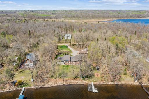 Expansive 200 feet of shoreline nestled in a peaceful wooded setting along Long Lake