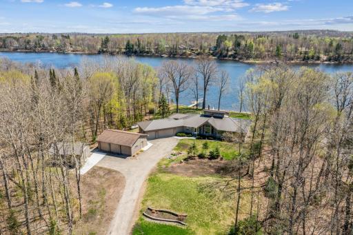 Captivating home with an ideal setting on Long Lake with private dock access.