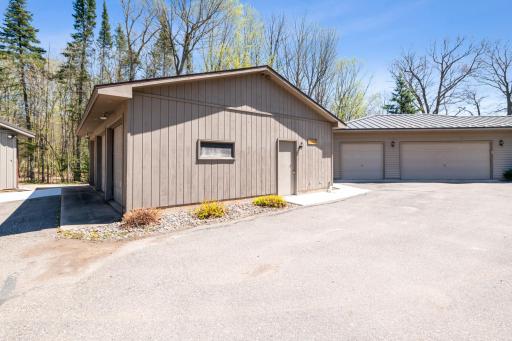 Detached three-car garage with easy access to the main home and lake amenities