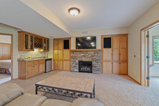 Another gas fireplace with built ins plus wet bar