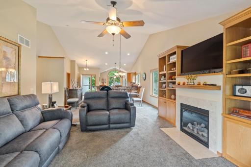 Living room features gas fireplace and built ins