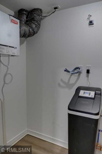 The mechanical room has an air exchanger as well as a water softener.