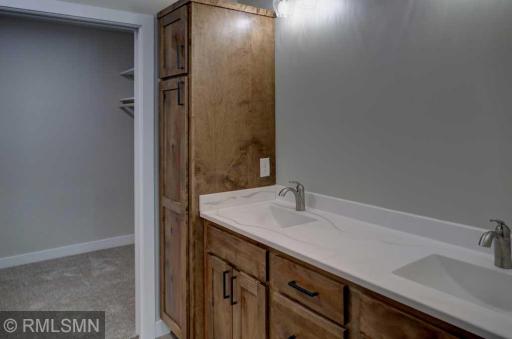 The primary bathroom features a double sink.