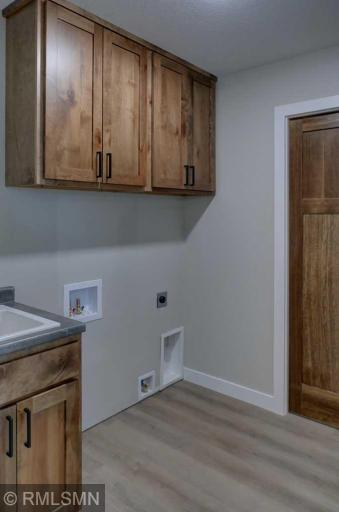 Located off the garage entry door is the laundry area with the option for either gas or electric dryer.