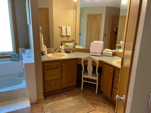 Primary bath has two sinks, lots of mirrors, step up tub, 4 ft shower, and 2 separate closets. One for he and one for she (maybe two for he ... wrong!!)