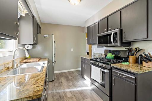 Well Equipped Kitchen with granite Countertops and newer appliances