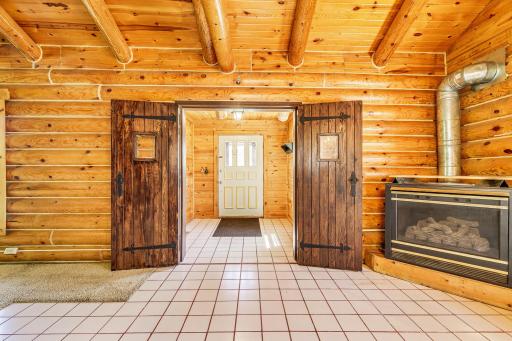 Welcome! Foyer/ entry to the great room. Rustic charm on 1.4 acres in Mahtomedi.