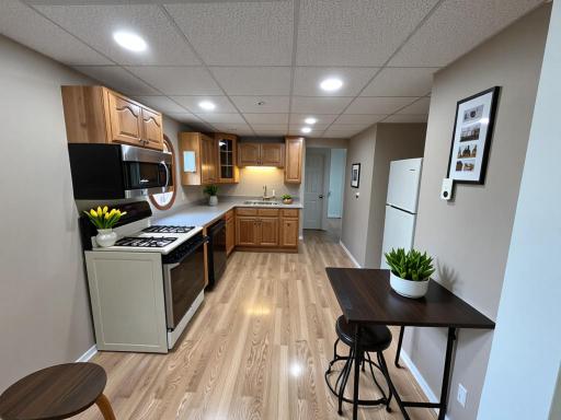 Kitchen- The furnishings and decor shown have been virtually staged.