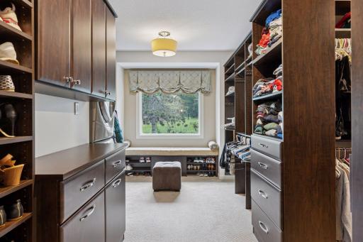 The primary suite boasts a fabulous walk-in closet (this is only showing a small portion of it) with its own private laundry.