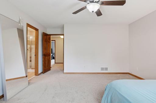 One of the three bedroom suites on the upper level-complete with 3/4 bathroom and walk-in closet.