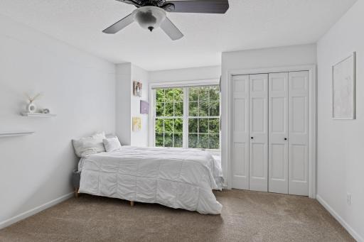 One of the three bedroom suites on the upper level-complete with full bathroom and 2 closets!