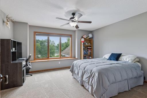 One of the three bedroom suites on the upper level-complete with 3/4 bathroom and walk-in closet.