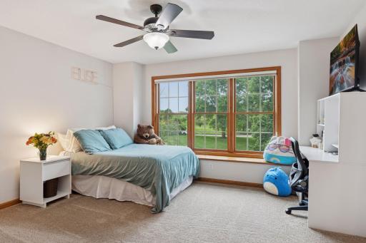 One of the three bedroom suites on the upper level-complete with 3/4 bathroom and walk-in closet.