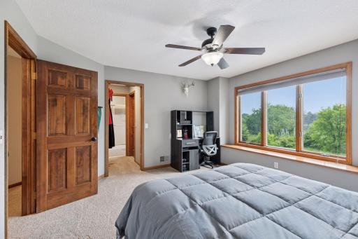 One of the three bedroom suites on the upper level-complete with 3/4 bathroom and walk-in closet.