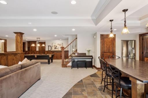 The walkout level was set up for entertaining! Featuring a second kitchen, family and recreation rooms, a dedicated theatre room, dedicated home gym and guest suite and two bathrooms plus a 3rd laundry area!