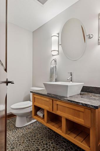 There is a 3/4 bathroom in the lower level and it's functional design allows one person to be showering/changing while someone is using the bathroom/sink.