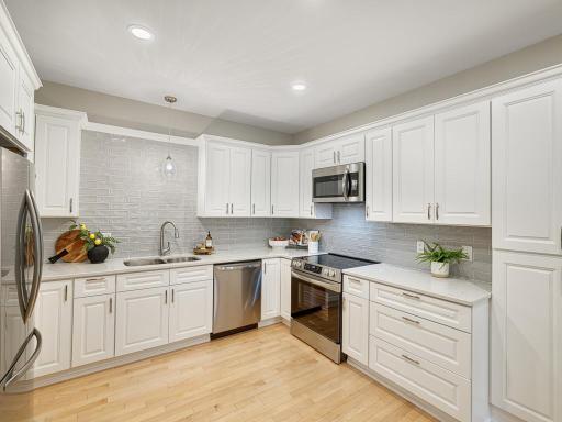 Stunning renovated kitchen with custom tiled backsplash