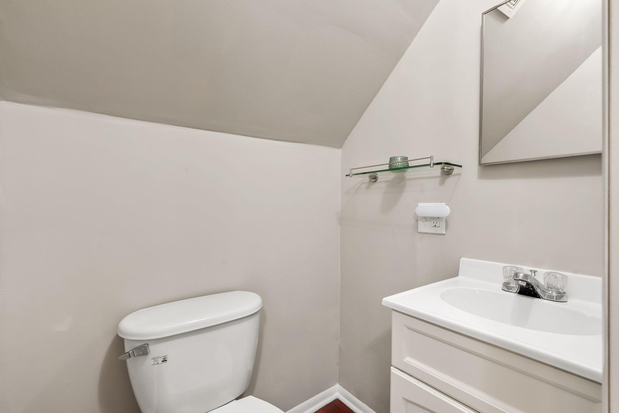 Upstairs half bathroom.