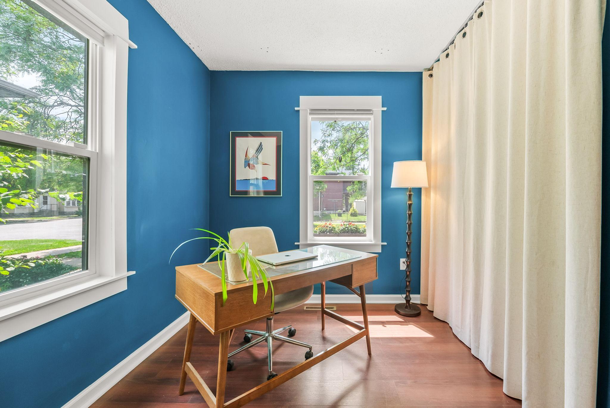 Off of the dining room is one of the two bedrooms - it is currently being used as an office.