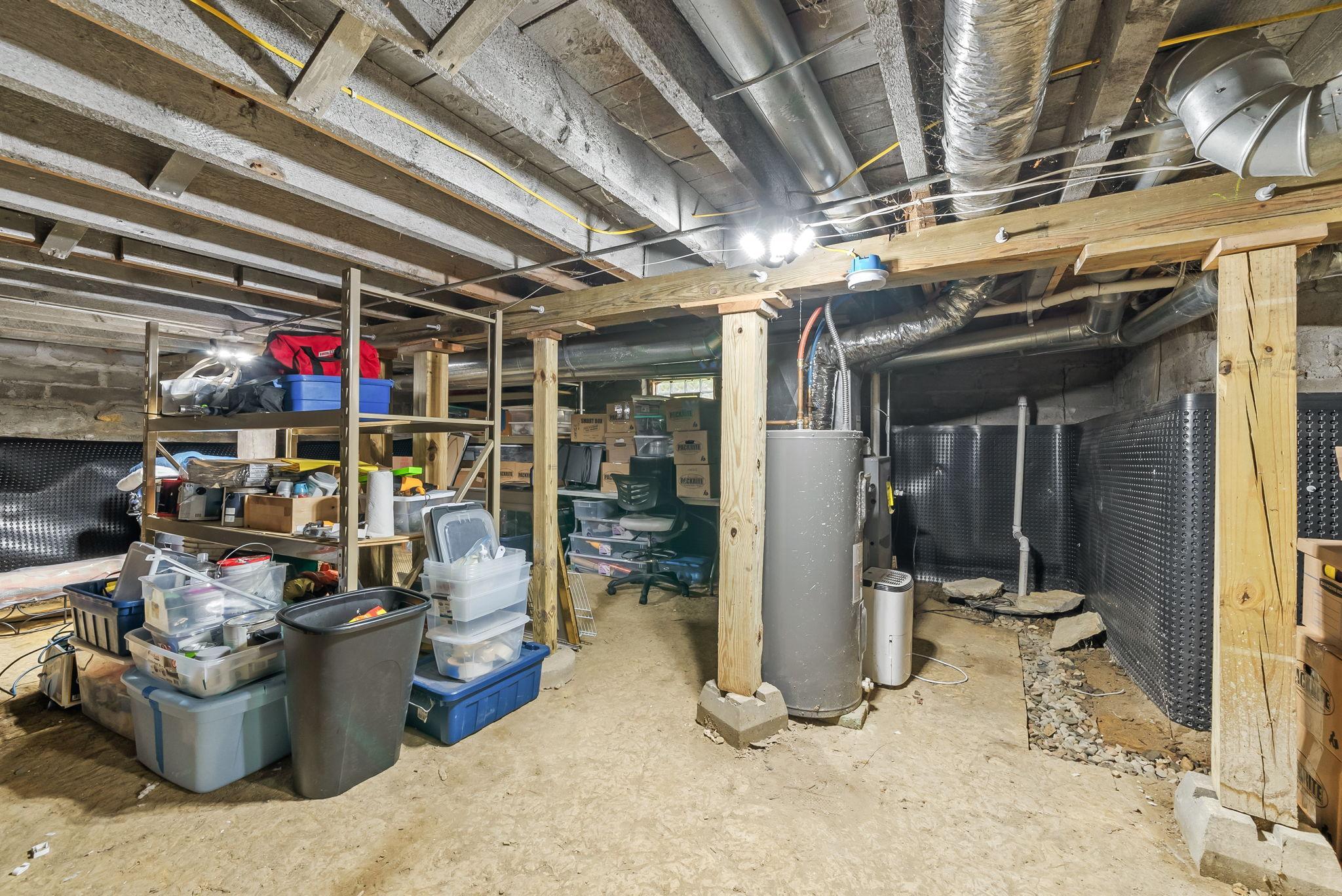 View of the unfinished basement. The basement is accessible through an updated cellar door on the exterior of the home.