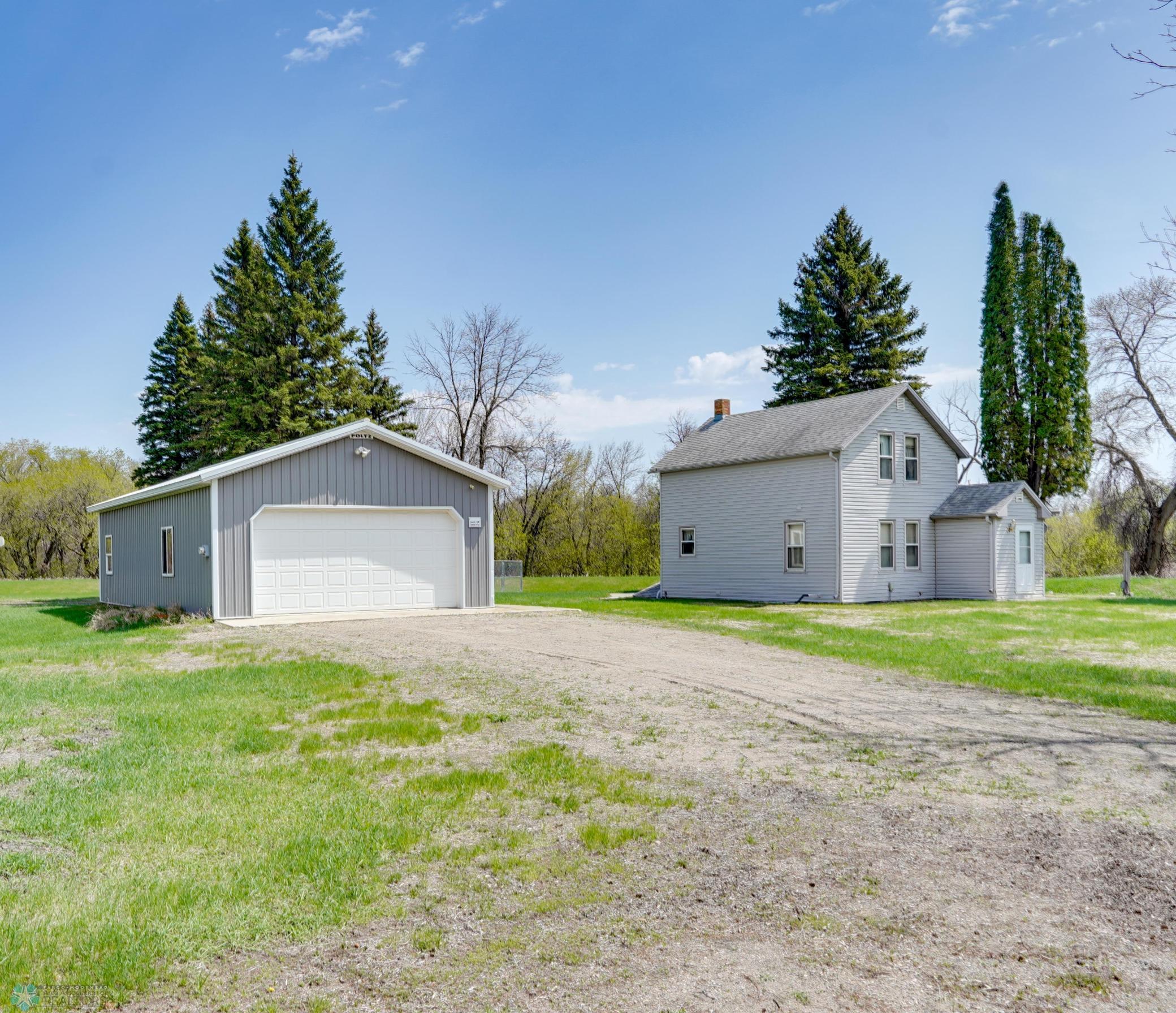 Pulling up to your garage & cute country home