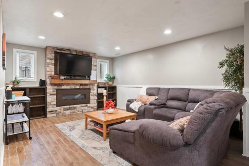 Lower Level Family with decorative fireplace