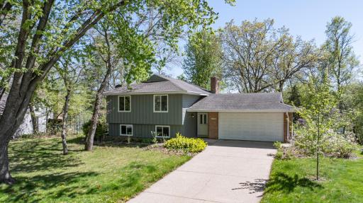 Welcome Home! Heavily wooded lakefront home in Apple Valley! Three bedrooms, two full baths, two car garage and fully fenced yard!