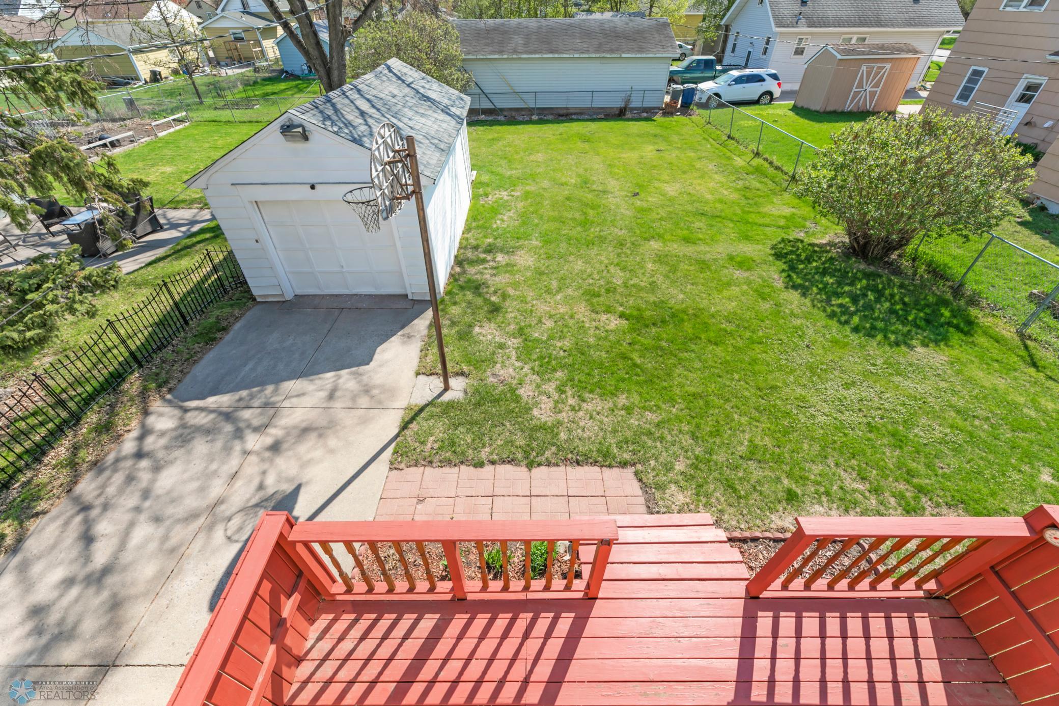 Backyard- view 1 wood sided garage