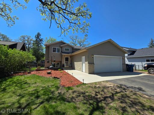 This endearing split-entry home welcomes you with fresh landscaping, inviting hues, and a clutter free environment.