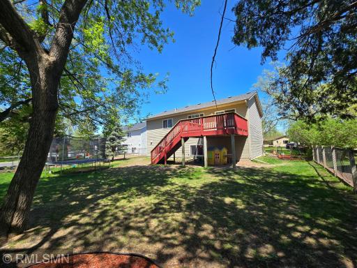 Views of the backyard showcase the great space that is conveniently fenced in.