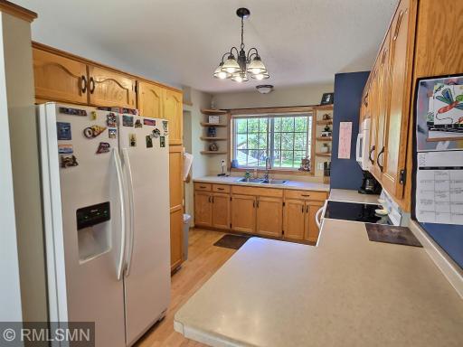 This unique floor plan offers the kitchen tucked back so that the generous front window sits above the sink and offers the best view of the front yard. The peninsula styled counter creates a great space for those to gather around.