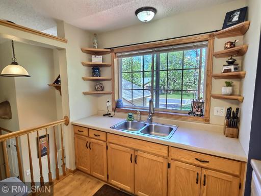 The balcony within the kitchen creates a more open-style feel allowing for site to the foyer.