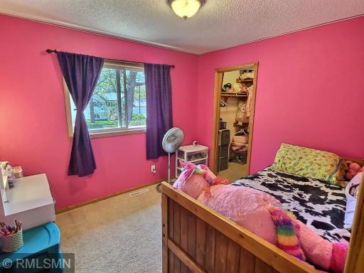 The second upper level bedroom is also generous in size and offers a walk-in closet as well as great views of the backyard.