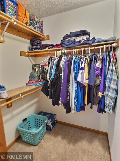 The walk in closet is a great size and plenty of options for storage.