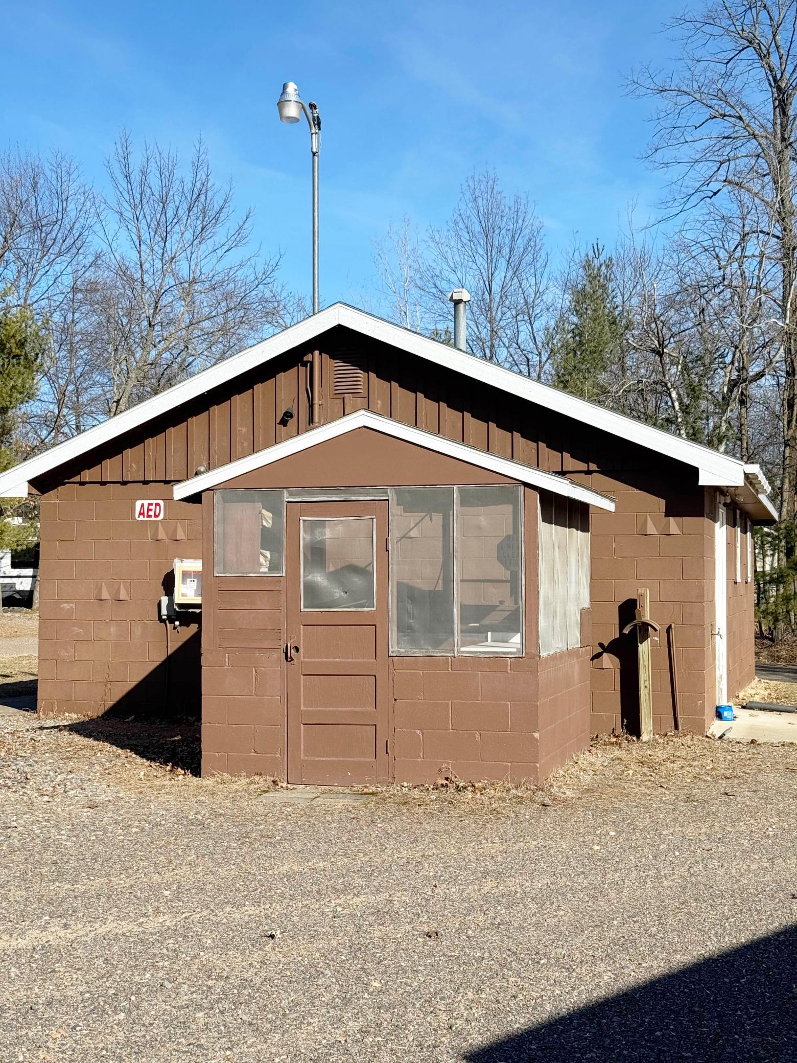 Next to the recreation center is a bathroom building and a fish cleaning station.