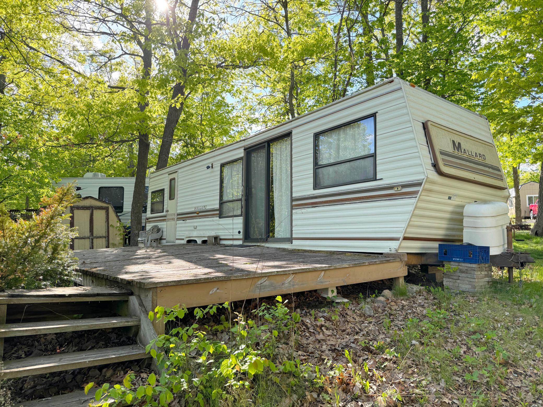 A closer look at the camper. Needs TLC or you can remove it and bring in your own rig!