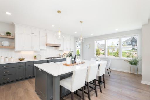 You will love this center island kitchen with a 5 burner gas cooktop, quartz counter tops and extra tall cabinetry for storage.