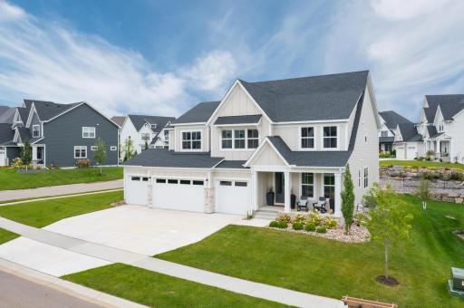 Nice curb appeal with a porch, dormers, 4 stall garage and large cement driveway for guests to park.