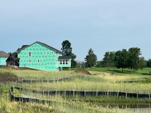 Actual photo of the house as of 6.30! A beautiful 4 season sunroom overlooking Sundance Greens golf course.