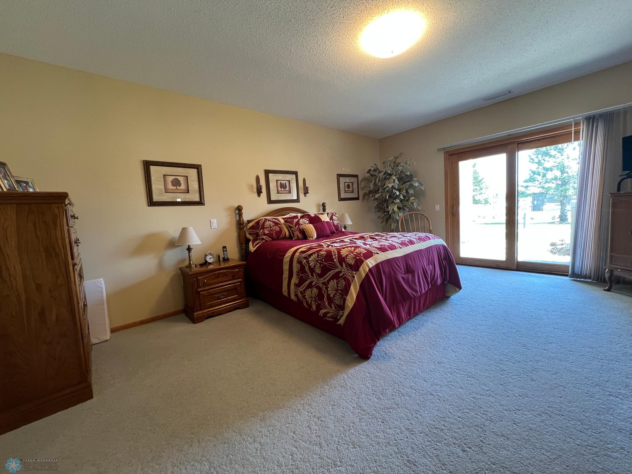 Huge primary bedroom with patio