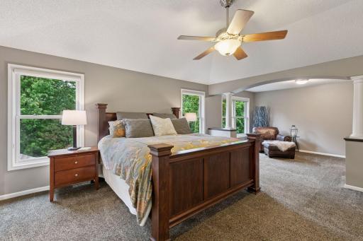 Luxurious primary bedroom suite, complete with a sitting area.