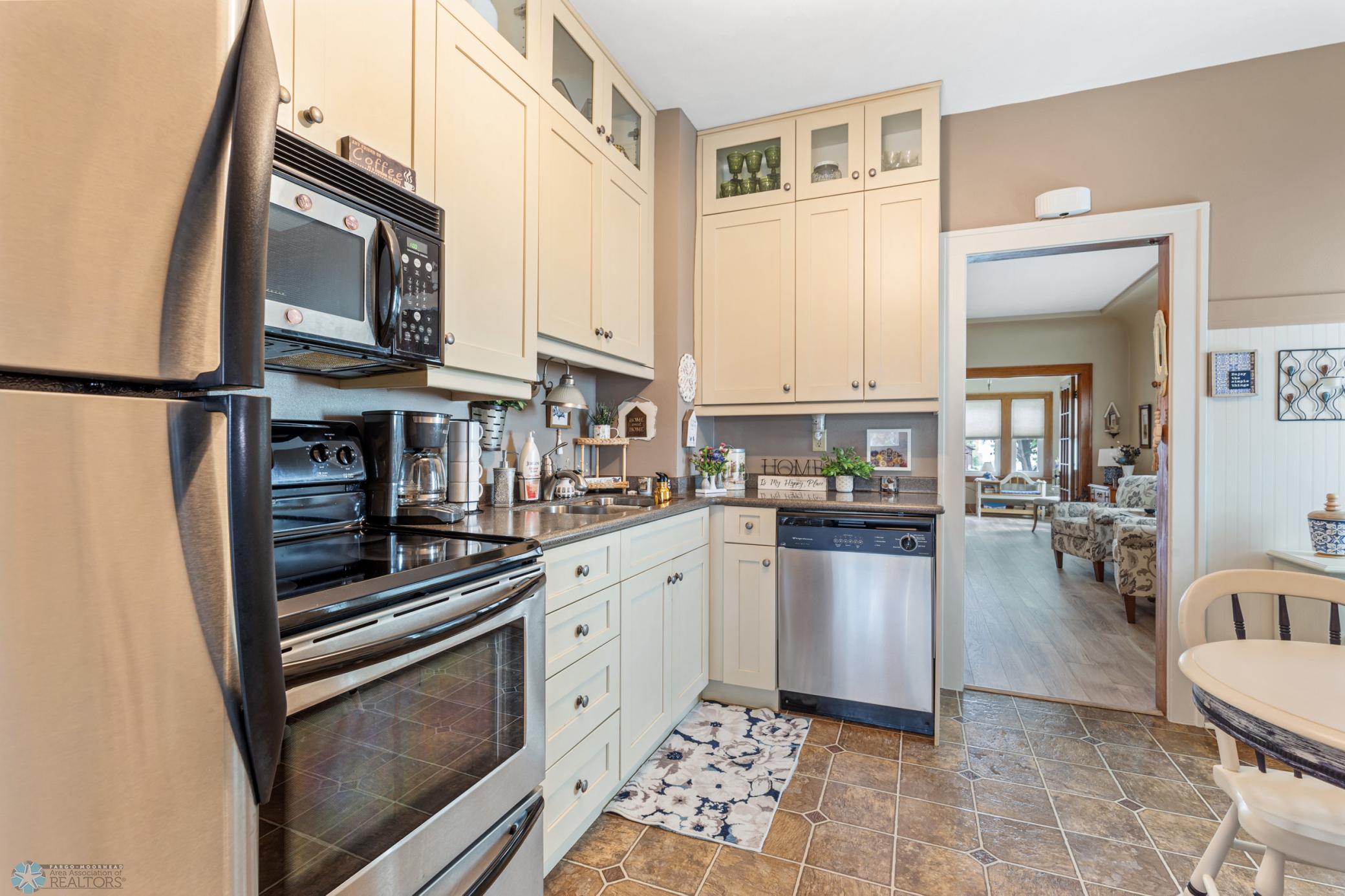 Kitchen- Stainless Steel Appliances & Corian Countertops
